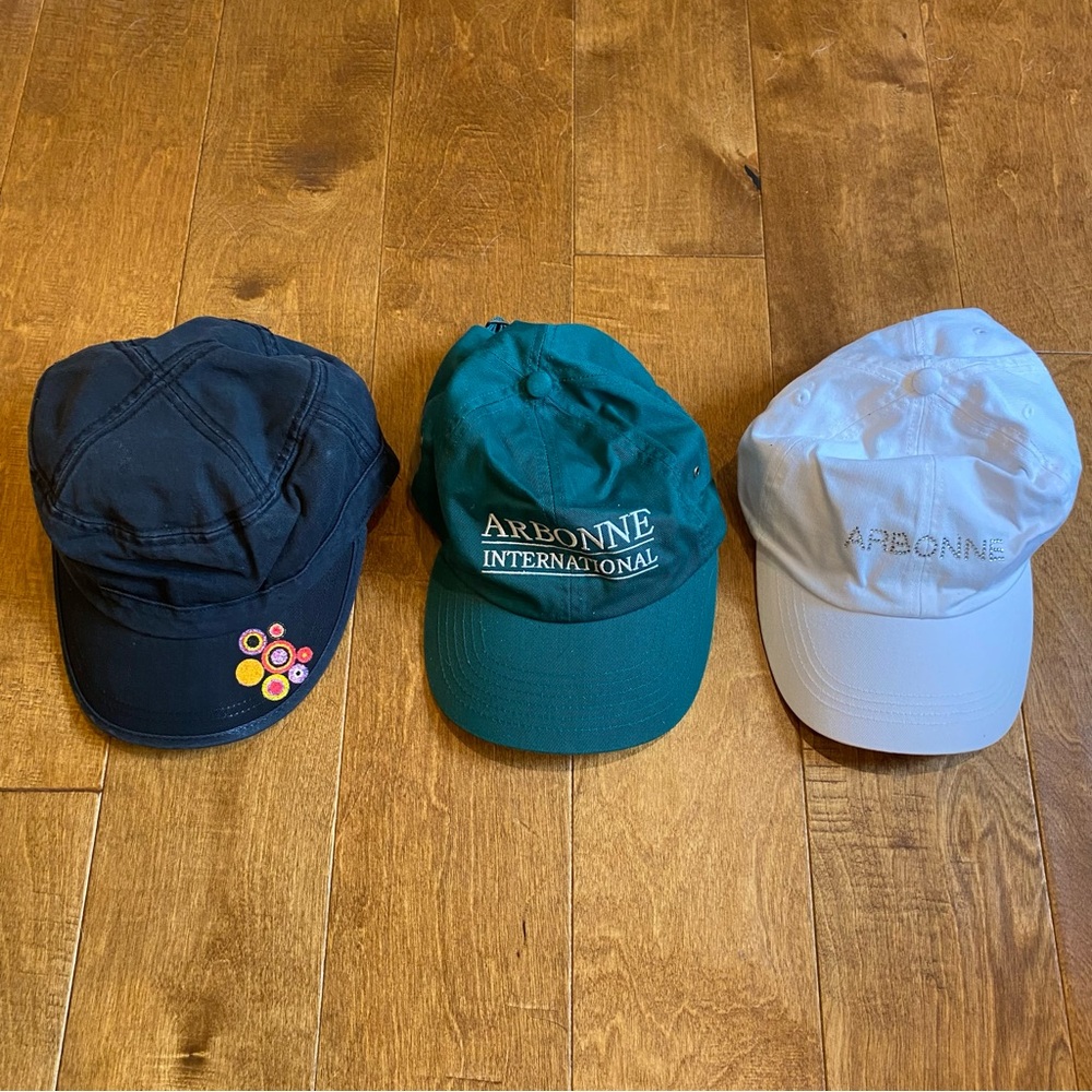 3 Arbonne hats in Black, Green, and White